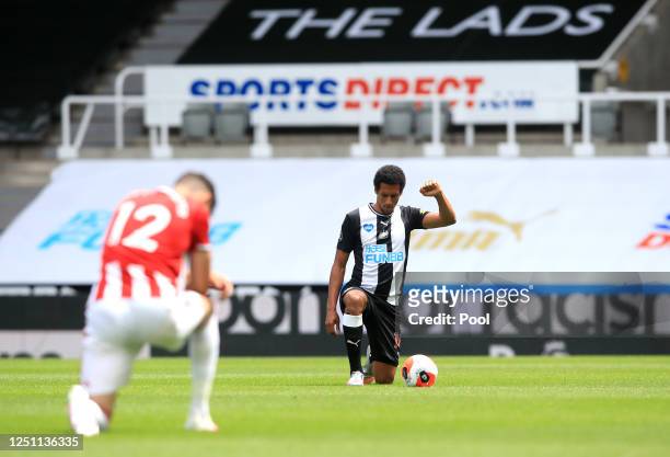 Isaac Hayden of Newcastle United takes a knee in support of the Black Lives Matter movement during the Premier League match between Newcastle United...