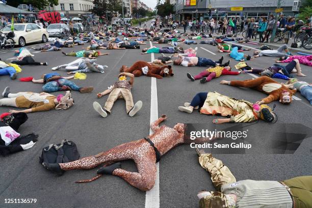 Supporters of the Extinction Rebellion movement play dead after dancing to disco hits during a "Discobedience" protest dance march on June 21, 2020...