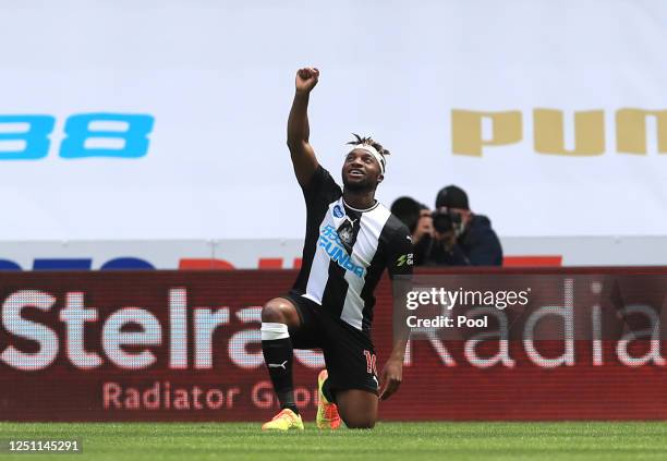 Allan Saint-Maximin of Newcastle United takes a knee as he celebrates after scoring his sides first goal during the Premier League match between...