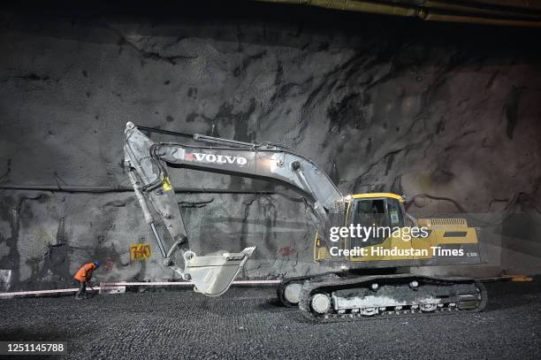 Construction workers work inside Asias longest bi-directional Zojila Tunnel, on the Srinagar-Ladakh highway, in the east of Srinagar, on April 9,...