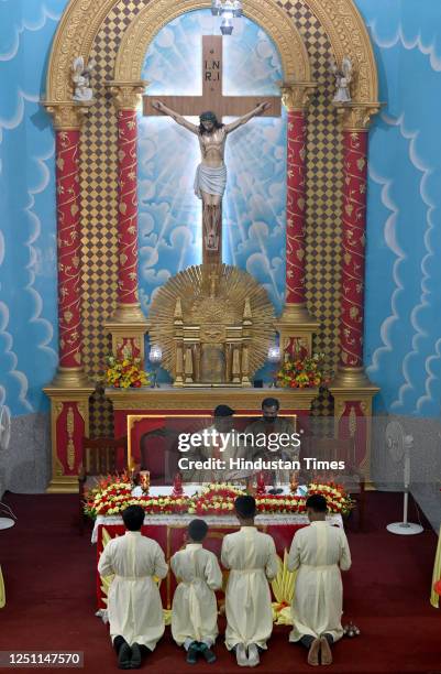 Priest leads prayers on the occasion of Easter day inside a church at Sector-34, on April 9, 2023 in Noida, India. Easter is celebrated to mark the...