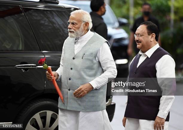 Prime Minister Narendra Modi with BJP National President J.P. Nadda upon his arrival to attend BJP's Central Election Committee meeting, ahead of the...