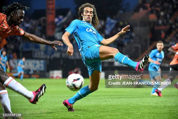 Lorient's Ivorian defender Bamo Meite fights for the ball with Marseille's French midfielder Matteo Guendouzi during the French L1 football match...