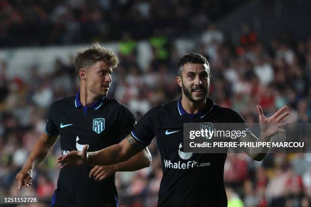 Atletico Madrid's Spanish defender Mario Hermoso celebrates with Atletico Madrid's Spanish midfielder Marcos Llorente after scoring his team's second...