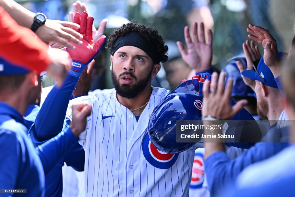 Edwin Luis Rios Edwin Rios of the Chicago Cubs high fives teammates in the dugout ...
