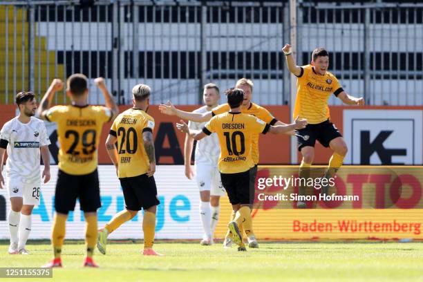Marco Hartmann of SG Dynamo Dresden celebrates with teammates after scoring his team's first goal during the Second Bundesliga match between SV...