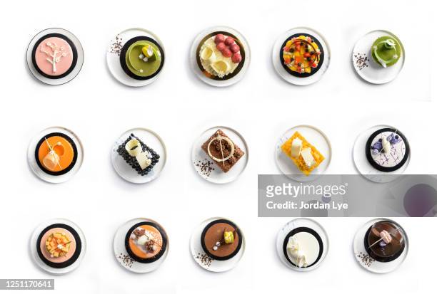 flat lay of varieties of whole cake - jordan weiss stock-fotos und bilder
