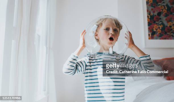 little boy imagines he's an astronaut - rockets game stock pictures, royalty-free photos & images