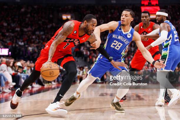 Will Barton of the Toronto Raptors drives to the net against Lindell Wigginton of the Milwaukee Bucks during the first half of their NBA game at...