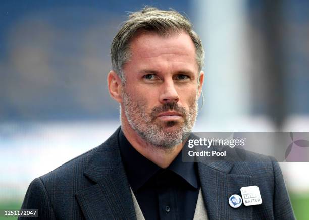 Skysports pundit Jamie Carragher looks on during the Premier League match between Everton FC and Liverpool FC at Goodison Park on June 21, 2020 in...