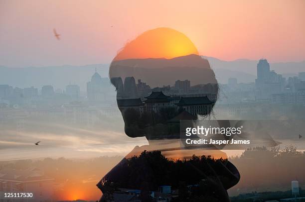 woman looking at sunset in beijing,china - digital composite stock-fotos und bilder
