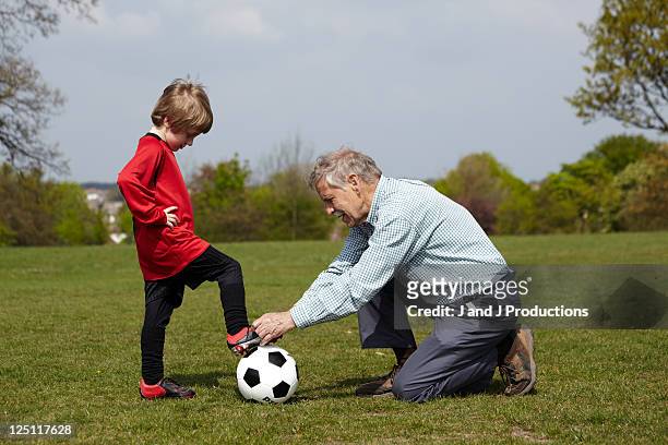 boy with grandfather - nieto fotografías e imágenes de stock
