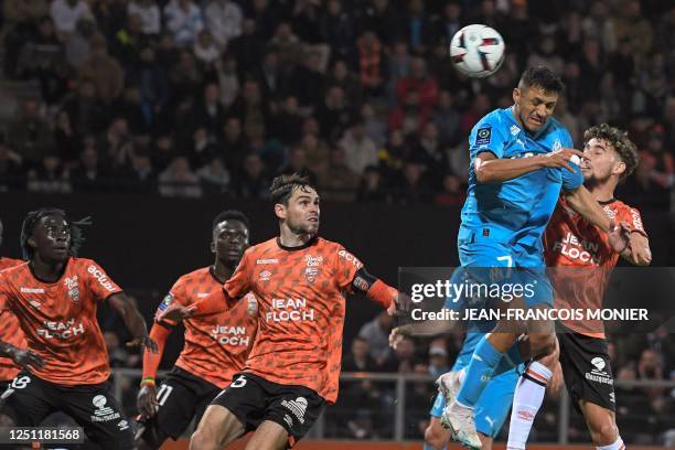 Marseille's Chilean forward Alexis Sanchez fights for the ball with Lorient's French forward Adil Aouchiche during the French L1 football match...