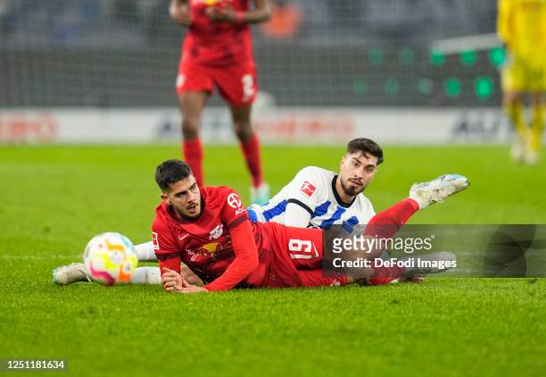 Suat Serdar of Hertha BSC and André Silva of RB Leipzig battle for the ball during the Bundesliga match between Hertha BSC and RB Leipzig at...