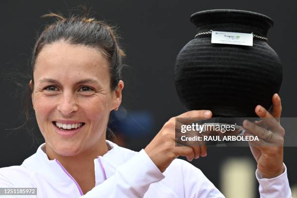 Germany's Tatjana Maria displays the trophy after winning the WTA 250 Colsanitas Cup by defeating US Peyton Stearns 6-3, 2-6, 6-4 in the women's...