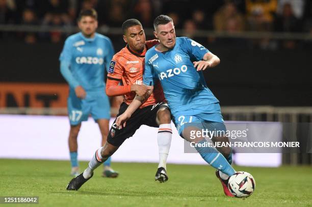 Lorient's French midfielder Julien Ponceau fights for the ball with Marseille's French midfielder Jordan Veretout during the French L1 football match...