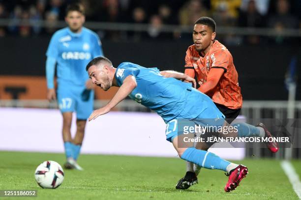 Marseille's French midfielder Jordan Veretout fights for the ball with Lorient's French midfielder Julien Ponceau during the French L1 football match...