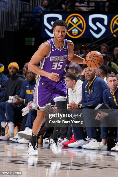 Dozier of the Sacramento Kings dribbles the ball during the game against the Denver Nuggets on April 9, 2023 at the Ball Arena in Denver, Colorado....