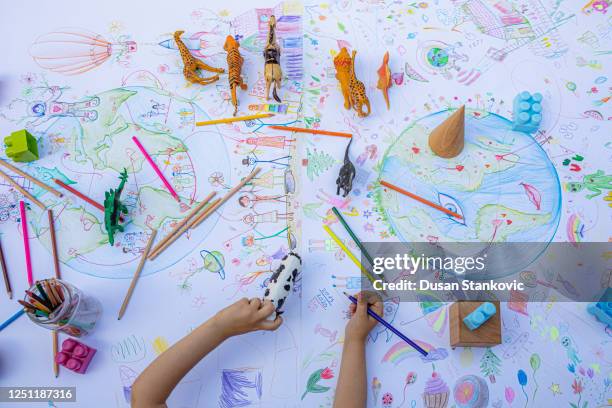 child drawing planet earth - world democracy stock pictures, royalty-free photos & images