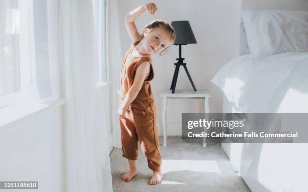 cute little girl performs ballet move - daily sport girls bildbanksfoton och bilder