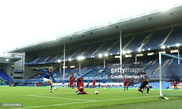 Tom Davies of Everton shoots but hits the post and misses a chance at goal during the Premier League match between Everton FC and Liverpool FC at...
