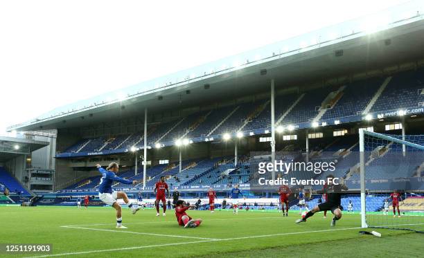 Tom Davies of Everton shoots but hits the post and misses a chance at goal during the Premier League match between Everton FC and Liverpool FC at...
