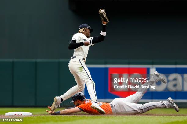 Kyle Tucker of the Houston Astros steals second base against Nick Gordon of the Minnesota Twins in the sixth inning of the game at Target Field on...