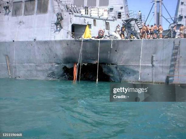 This recent undated photo released 27 October 2000, by the National Security News Service shows US sailors on deck and damage to the USS Cole after a...