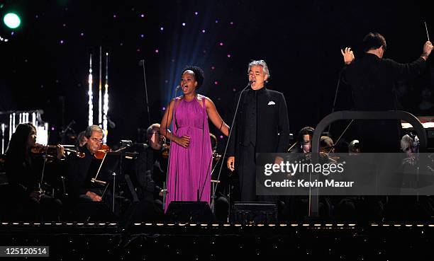 Pretty Yende and Andrea Bocelli perform at the Central Park, Great Lawn on September 15, 2011 in New York City.