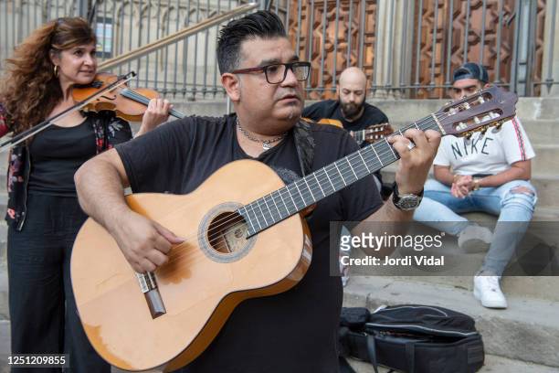 Catalan rumba band Sabor de Gracia perform "Hallelujah" by Leonard Cohen to mark de World Music Day on the stairs of Barcelona Cathedral on June 21...