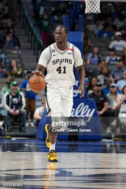 Gorgui Dieng of the San Antonio Spurs moves the ball during the game against the Dallas Mavericks on April 9, 2023 at the American Airlines Center in...