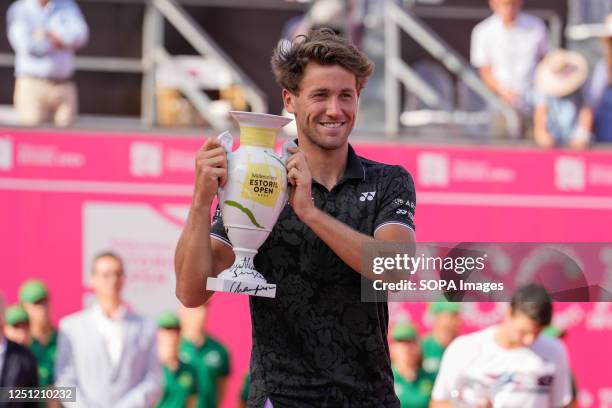 Casper Ruud of Norway holds a trophy after the Final of the Millennium Estoril Open tournament against Miomir Kecmanovic of Serbia at CTE- Clube de...
