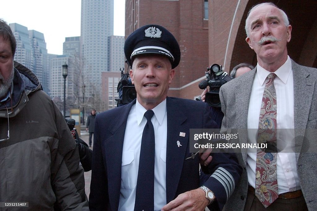 Richard Ried American Airlines Pilot Cpt. Hans Mantel is escorted to his car 30 ...