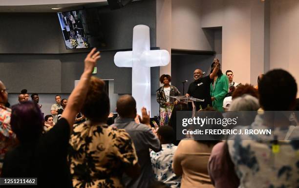 People attend a Easter Sunday mass at the Los Angeles Mission ahead of the annual Easter Celebration for the homeless on April 9, 2023 in Los...