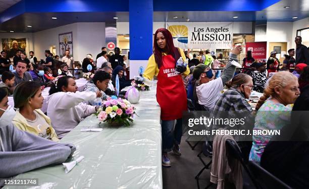 Actress Garcelle Beauvais delivers water to people attending lunch at the annual Los Angeles Mission Easter Celebration for the homeless on April 9,...
