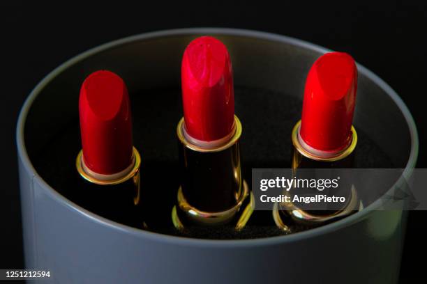 lipsticks still life - orange lipstick stock pictures, royalty-free photos & images