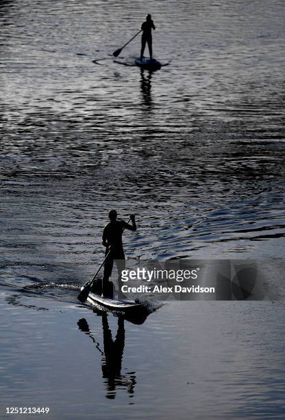Member of the public is seen on the river on June 20, 2020 in London, England .