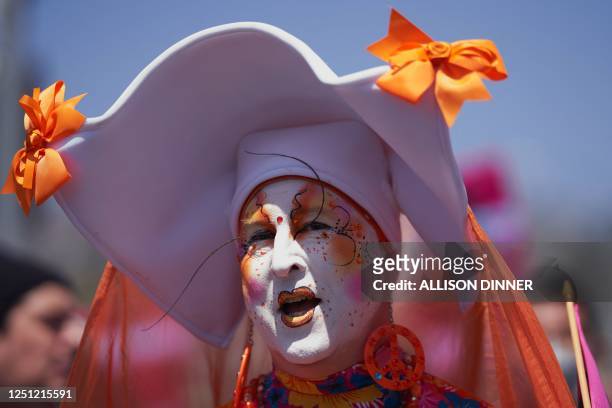 Member of The Sisters of Perpetual Indulgence marches with LGBTQ+ activists during the Los Angeles LGBT Center's "Drag March LA: The March on Santa...