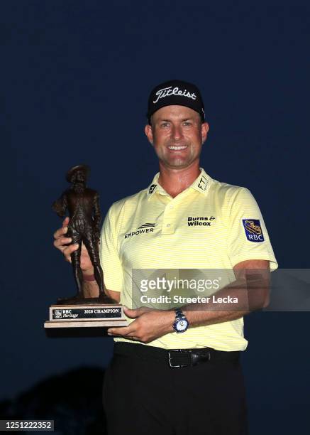 Webb Simpson of the United States celebrates with the trophy after winning during the final round of the RBC Heritage on June 21, 2020 at Harbour...