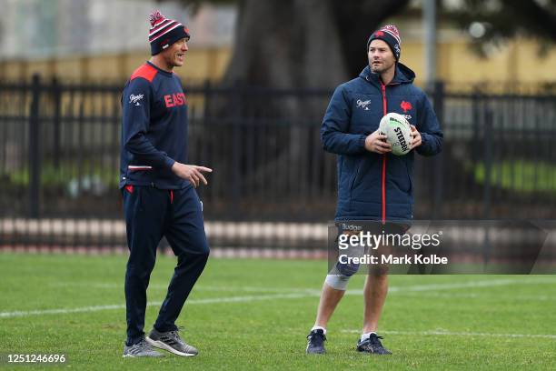 Craig Fitzgibbon speaks to Boyd Cordner during a Sydney Roosters NRL training session at Kippax Lake on June 22, 2020 in Sydney, Australia.