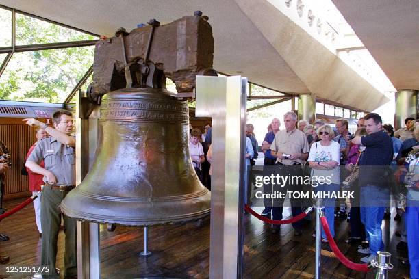 Visitors to the Liberty Bell in Philadelphia listen to a Park Service guide 12 September following the re-opening of Philadephia's National Historic...