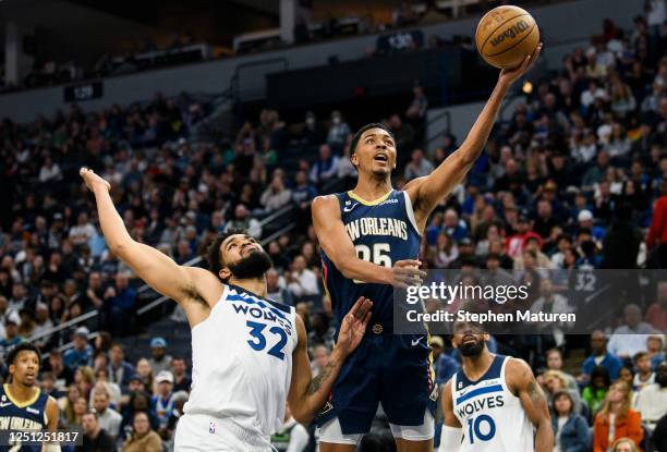 Trey Murphy III of the New Orleans Pelicans puts up a shot over Karl-Anthony Towns of the Minnesota Timberwolves in the first quarter at Target...