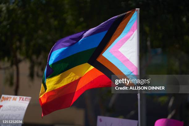 Progress Pride Flag is held above the crowd of LGBTQ+ activists during the Los Angeles LGBT Center's "Drag March LA: The March on Santa Monica...