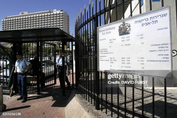 Israeli policemen stand guard at the entrance to the British embassy in Tel Aviv during a standoff between Israeli police and an armed man, 31 August...