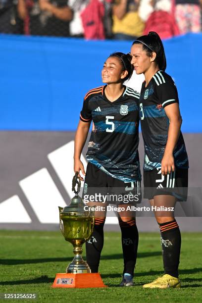 Fabiana Vallejos and Eliana Stabile of Argentina celebrate with the trophy after winning an international friendly match between Argentina and...