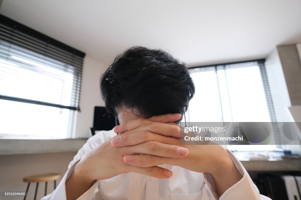 Thinking Asian businessman