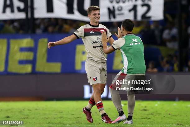 Andrew Teuten of Colon celebrates with teammate after scoring the team´s second goal during a Liga Profesional 2023 match between Boca Juniors and...