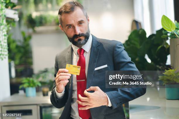 man business suit - hand holding credit card stock pictures, royalty-free photos & images