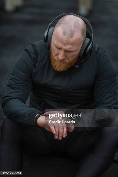 middle aged redhead handsome man in outdoor gym - shaved head stock pictures, royalty-free photos & images
