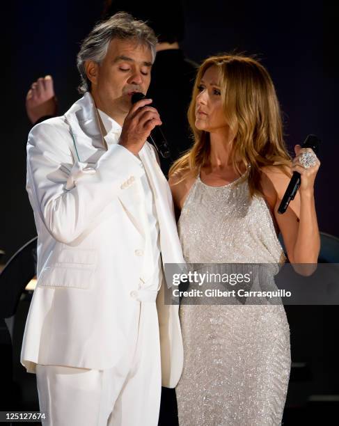 Singers Andrea Bocelli and Celine Dion perform at the Central Park, Great Lawn on September 15, 2011 in New York City.